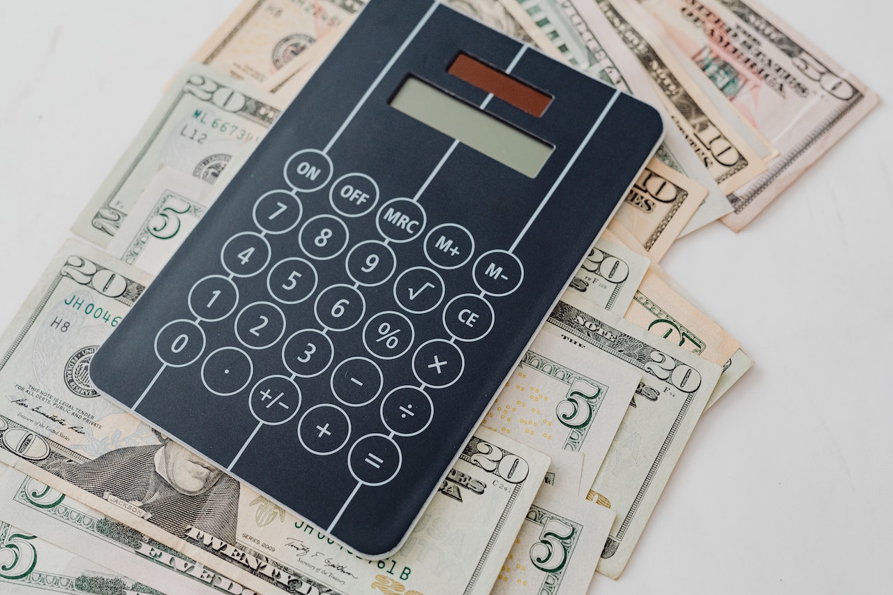 Calculator and money logo